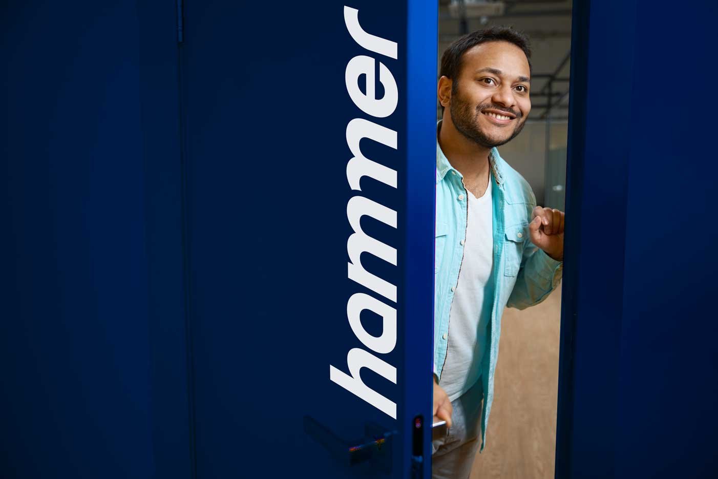 portrait-of-hindu-man-inviting-you-to-enter-office-2024-10-22-03-01-04-utc-blue