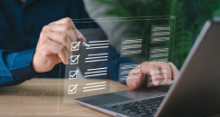 person at laptop using an AR checklist